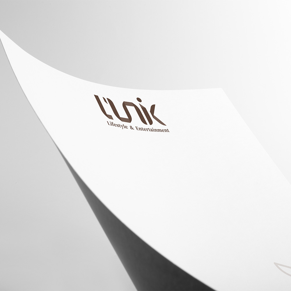 L'UNIK, Papier En-tête